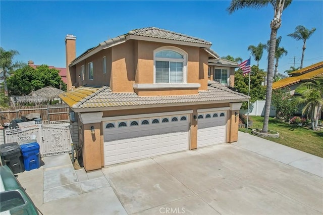 3723 Pinto Pl, Ontario, CA 91761 - mediterranean / spanish-style home with a tile roof, stucco siding, an attached garage, and concrete driveway