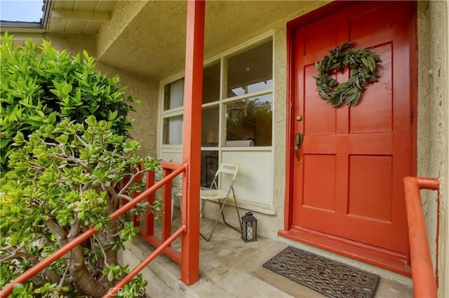 10345 Sherman Grove Ave, Sunland, CA 91040 - doorway to property featuring a porch and stucco siding