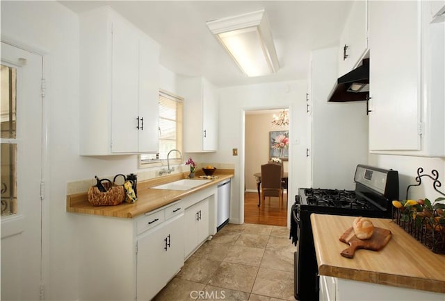 10345 Sherman Grove Ave, Sunland, CA 91040 - kitchen featuring stainless steel appliances, a sink, under cabinet range hood, wood counters, and a chandelier