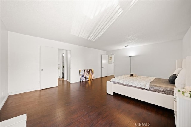 bedroom featuring wood finished floors