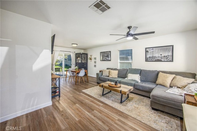 1388 E 39th St, San Bernardino, CA 92404 - living area with wood finished floors, baseboards, and a ceiling fan