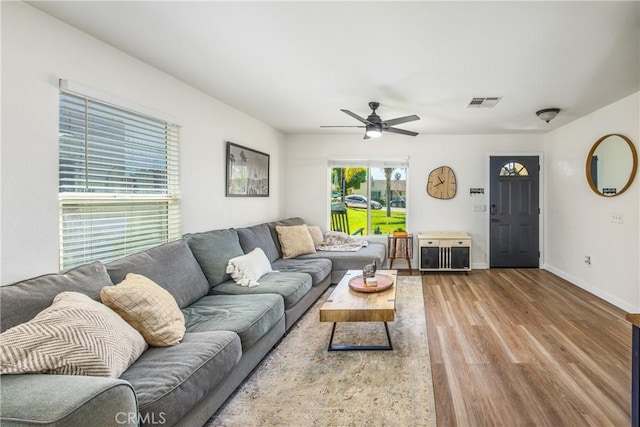 1388 E 39th St, San Bernardino, CA 92404 - living room featuring wood finished floors, a ceiling fan, and baseboards