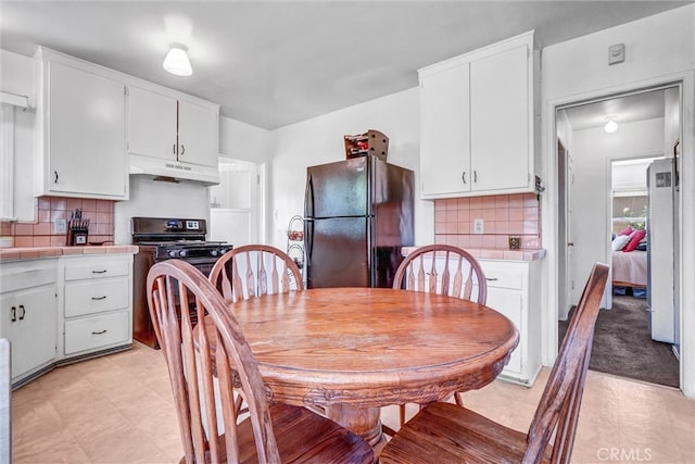 dining area featuring light flooring