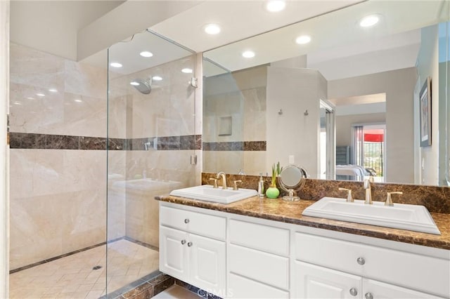 27345 Via Capri, San Juan Capistrano, CA 92675 - ensuite bathroom with walk in shower, double vanity, recessed lighting, and tile walls