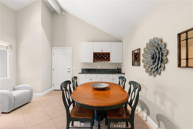 27345 Via Capri, San Juan Capistrano, CA 92675 - dining area with high vaulted ceiling, a bar, baseboards, and light tile patterned flooring