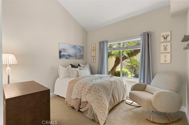 27345 Via Capri, San Juan Capistrano, CA 92675 - bedroom featuring lofted ceiling, light carpet, and baseboards