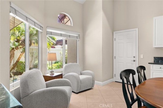 27345 Via Capri, San Juan Capistrano, CA 92675 - dining room with a towering ceiling, light tile patterned flooring, and baseboards