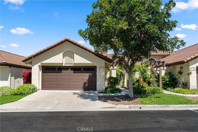 27345 Via Capri, San Juan Capistrano, CA 92675 - mediterranean / spanish-style home with stucco siding, an attached garage, concrete driveway, and a tiled roof