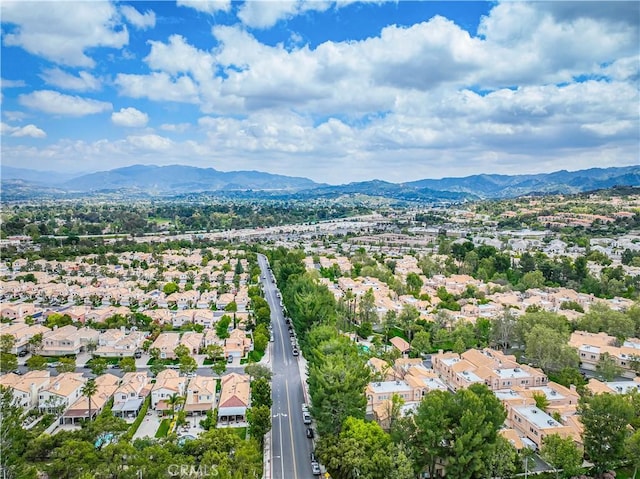 aerial perspective of suburban area featuring a mountainous background