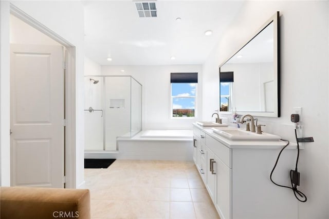 188 Merit, Irvine, CA 92618 - full bathroom featuring a shower stall, a bath, double vanity, tile patterned flooring, and recessed lighting