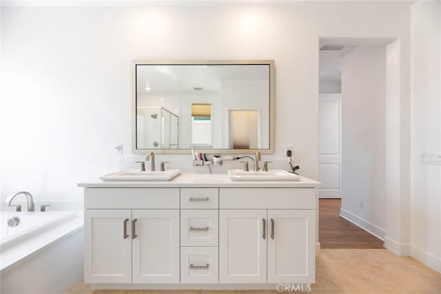 188 Merit, Irvine, CA 92618 - full bathroom with a shower stall, double vanity, a bath, and baseboards