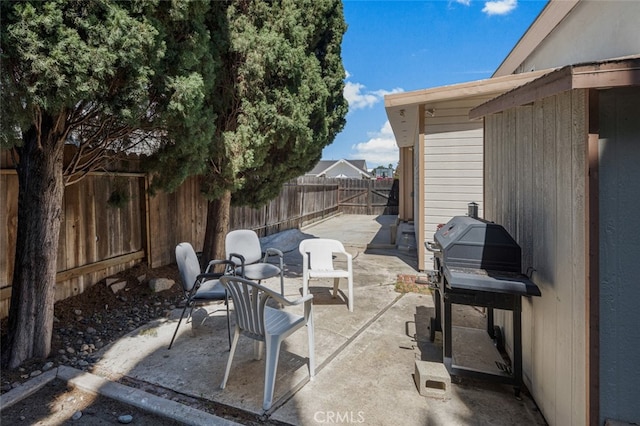 view of patio / terrace featuring grilling area and a fenced backyard