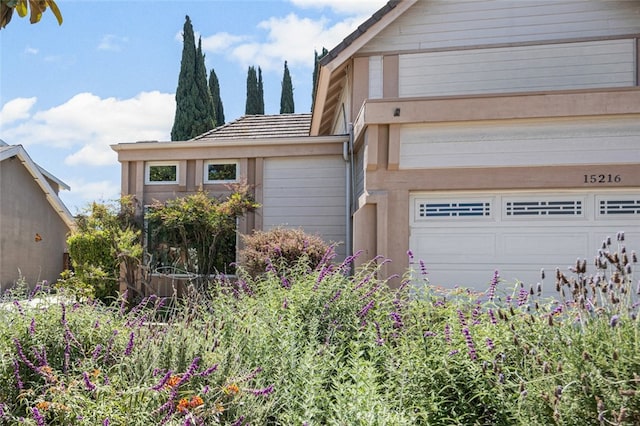 view of home's exterior with a garage