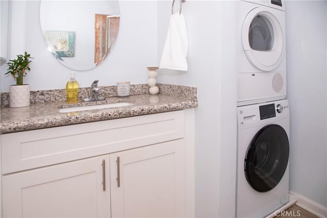 2852 Sawtelle Blvd Unit 41, Los Angeles, CA 90064 - laundry room featuring estacked washer and dryer and baseboards