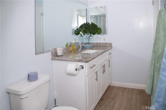 2852 Sawtelle Blvd Unit 41, Los Angeles, CA 90064 - bathroom featuring toilet, vanity, wood finished floors, and baseboards