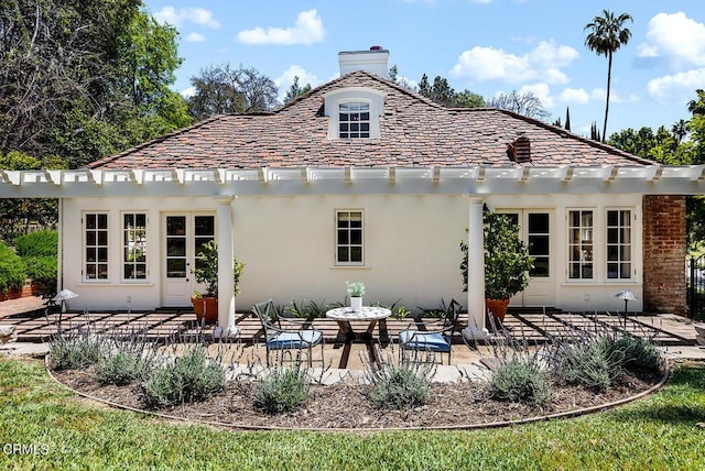 741 Burleigh Dr, Pasadena, CA 91105 - rear view of house with a chimney, a high end roof, stucco siding, and a patio