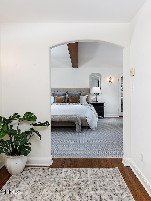 741 Burleigh Dr, Pasadena, CA 91105 - bedroom with arched walkways, baseboards, and wood finished floors