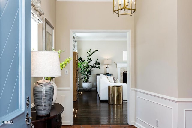 741 Burleigh Dr, Pasadena, CA 91105 - hallway featuring a chandelier, dark wood finished floors, a wainscoted wall, and ornamental molding