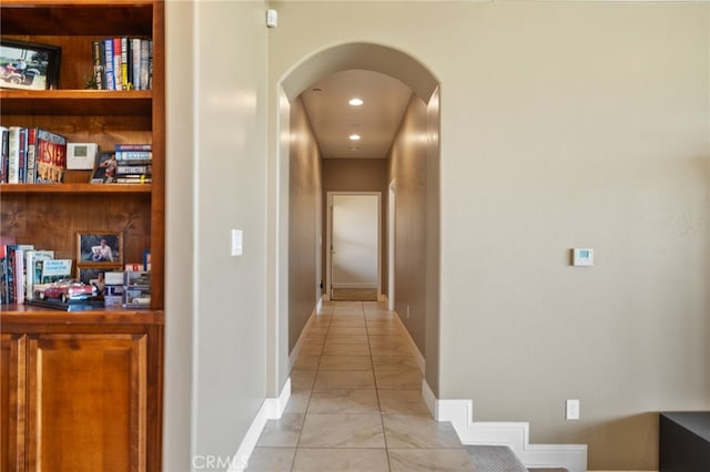 38792 Comanche Point Rd, Arvin, CA 93203 - hallway featuring arched walkways, light tile patterned floors, baseboards, and recessed lighting