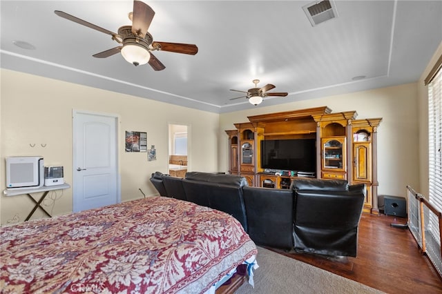 38792 Comanche Point Rd, Arvin, CA 93203 - bedroom with dark wood finished floors, a ceiling fan, and ensuite bathroom