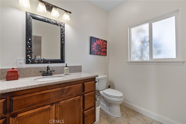 38792 Comanche Point Rd, Arvin, CA 93203 - bathroom featuring toilet, tile patterned floors, vanity, and baseboards