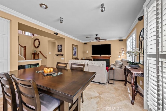 28456 Calex Dr, Valencia, CA 91354 - dining space with stairs, a ceiling fan, and crown molding