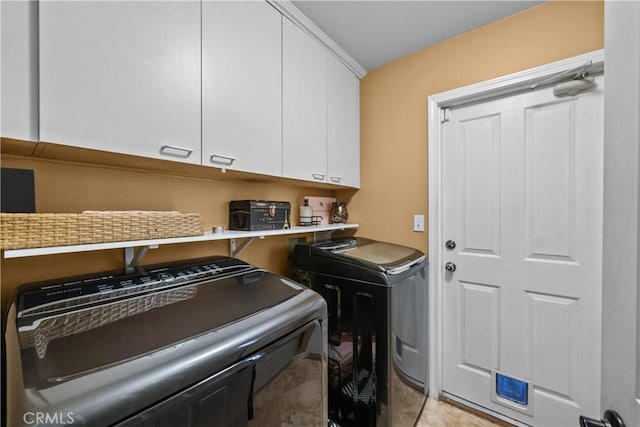 28456 Calex Dr, Valencia, CA 91354 - laundry room with independent washer and dryer, cabinet space, and light tile patterned floors