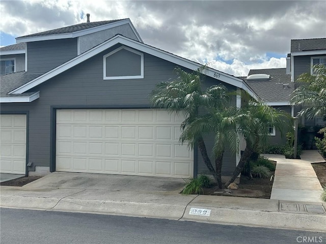 869 Encino Pl, Corona, CA 92882 - view of front of property with roof with shingles, driveway, and a garage