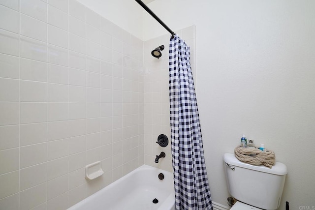 bathroom with shower / tub combo with curtain and toilet