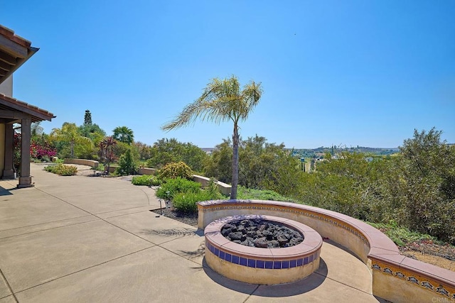 view of patio / terrace with a fire pit