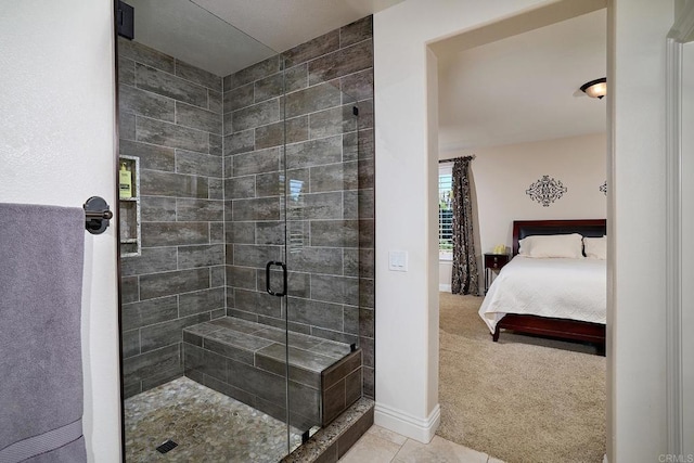 bathroom with ensuite bath, a stall shower, baseboards, and tile patterned floors