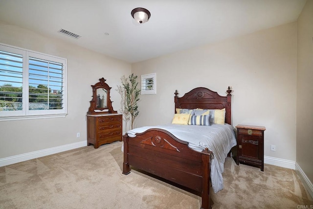 bedroom with carpet floors and baseboards