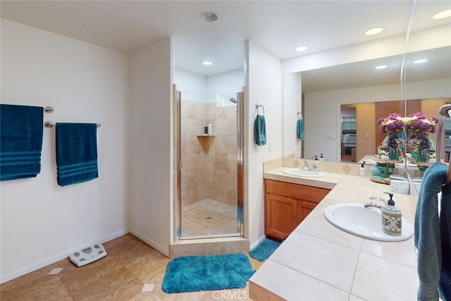 10647 Forbestown Rd, Challenge, CA 95925 - bathroom featuring a shower stall, double vanity, baseboards, recessed lighting, and tile patterned flooring