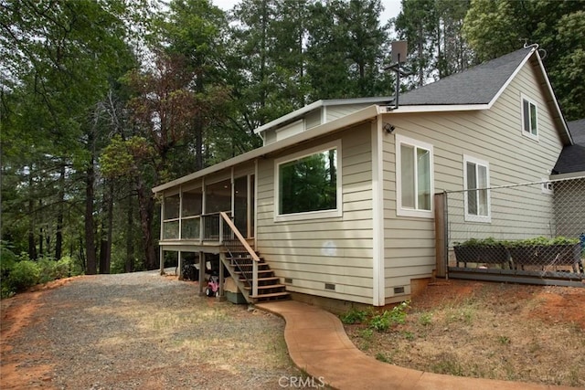 10647 Forbestown Rd, Challenge, CA 95925 - view of front of property featuring crawl space, a sunroom, stairs, fence, and a shingled roof