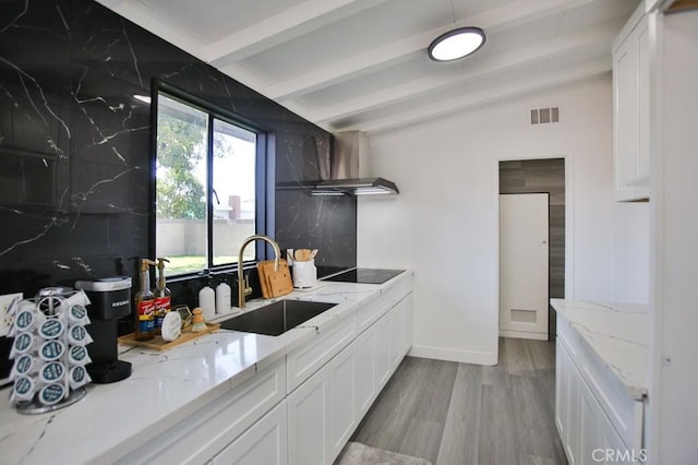 2540 W Picadilly Way, Anaheim, CA 92801 - kitchen with a sink, light wood-style flooring, wall chimney range hood, white cabinetry, and black electric cooktop