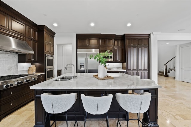 28 Dogwood, Lake Forest, CA 92630 - kitchen featuring a sink, stainless steel appliances, tasteful backsplash, under cabinet range hood, and a kitchen bar