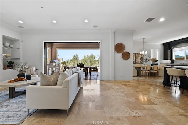 28 Dogwood, Lake Forest, CA 92630 - living area with ornamental molding, a chandelier, recessed lighting, stone tile floors, and baseboards