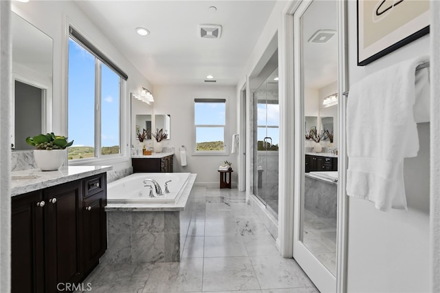 28 Dogwood, Lake Forest, CA 92630 - full bathroom with marble finish flooring, a bath, a shower stall, and two vanities