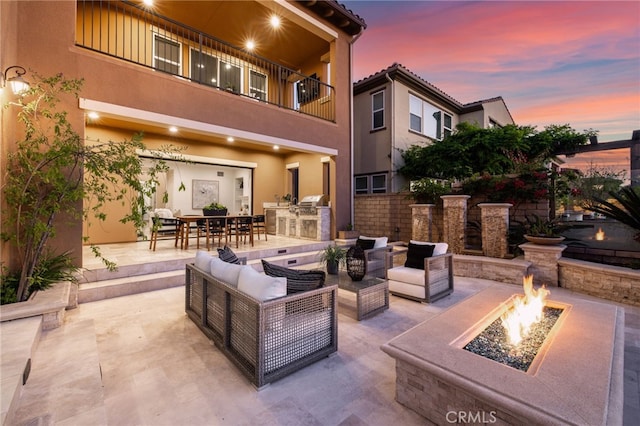 28 Dogwood, Lake Forest, CA 92630 - view of patio / terrace featuring an outdoor kitchen, an outdoor living space with a fire pit, a balcony, and outdoor dining space