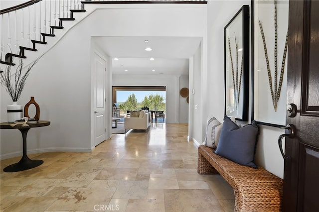 28 Dogwood, Lake Forest, CA 92630 - foyer entrance featuring baseboards, light stone finish flooring, recessed lighting, and stairway