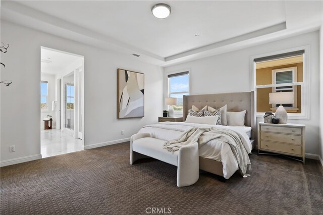28 Dogwood, Lake Forest, CA 92630 - bedroom with a tray ceiling, carpet, and baseboards
