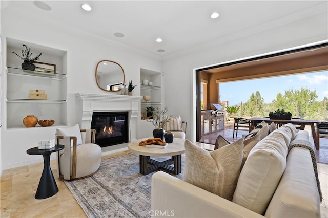 28 Dogwood, Lake Forest, CA 92630 - living area featuring built in shelves, plenty of natural light, ornamental molding, a glass covered fireplace, and recessed lighting
