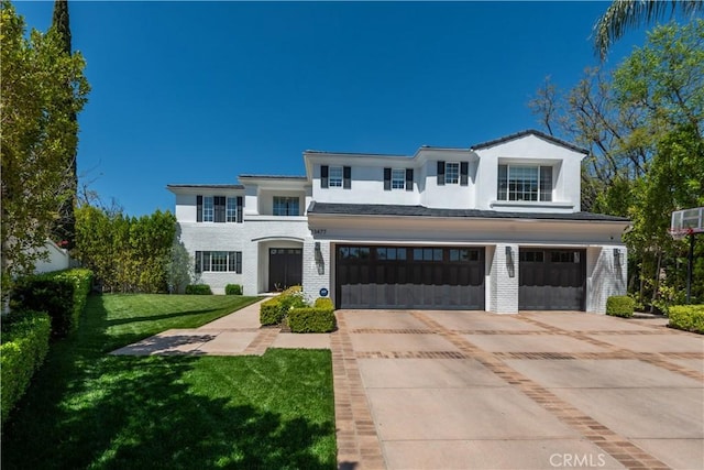 23477 Palm Dr, Calabasas, CA 91302 - view of front facade with an attached garage, driveway, a front lawn, stucco siding, and brick siding