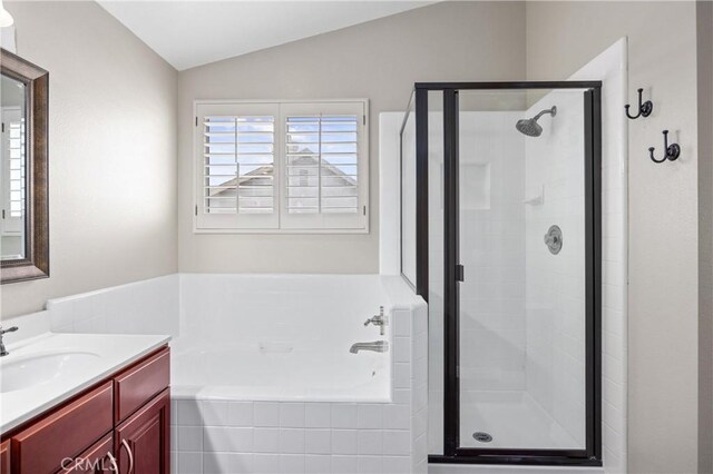 823 N Kintyre Dr, Orange, CA 92869 - bathroom with a shower stall, a bath, vaulted ceiling, and vanity