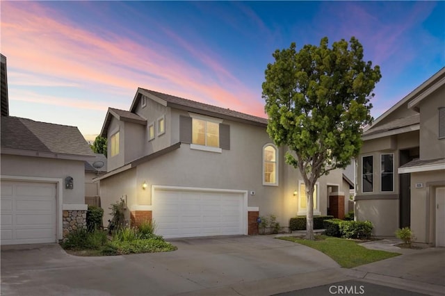 823 N Kintyre Dr, Orange, CA 92869 - view of front of home featuring stucco siding, concrete driveway, and an attached garage