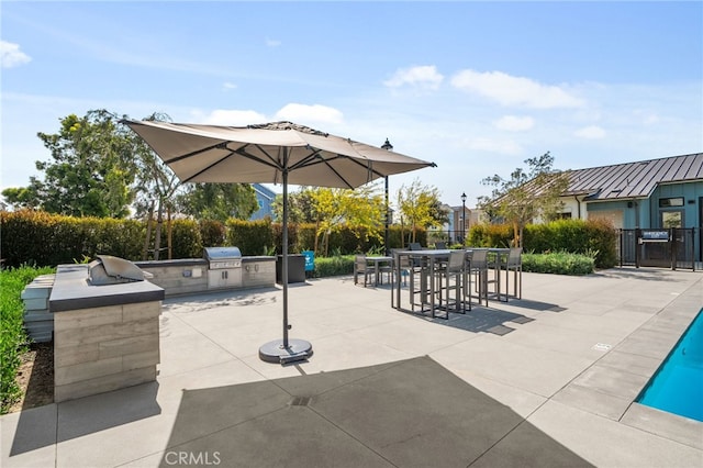 4565 S Bryant Paseo Ln, Ontario, CA 91762 - view of property's community with an outdoor kitchen, a patio, outdoor dining space, and a swimming pool