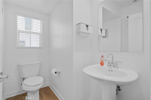 4565 S Bryant Paseo Ln, Ontario, CA 91762 - bathroom with toilet, wood finished floors, baseboards, and a sink