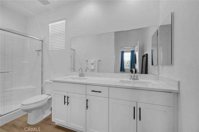 4565 S Bryant Paseo Ln, Ontario, CA 91762 - bathroom with a stall shower, toilet, and double vanity