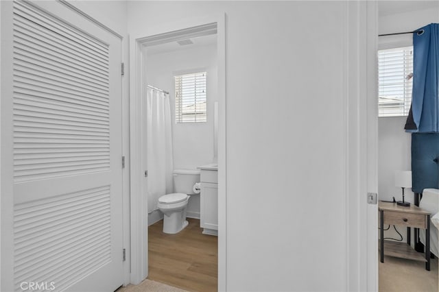 4565 S Bryant Paseo Ln, Ontario, CA 91762 - bathroom featuring toilet and wood finished floors
