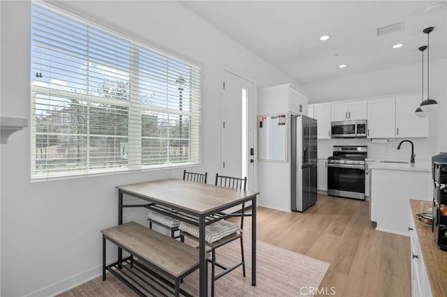 4565 S Bryant Paseo Ln, Ontario, CA 91762 - dining area with light wood finished floors and recessed lighting